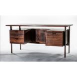 A FINE ROSEWOOD EXECUTIVES PEDESTAL DESK, DANISH, 1960s, the rectangular top above two floating