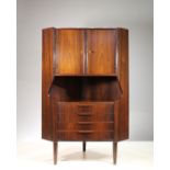 A ROSEWOOD CORNER CABINET, DANISH 1960s, BY GUNNI OMAN, with upper cupboard, above a shelf and