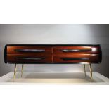 A FINE ROSEWOOD SIDE CABINET, ITALIAN 1960s, with shaped sides, comprising four drawers, raised on