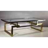 A BRUSHED METAL AND GILT RECTANGULAR COFFEE TABLE, ITALIAN, 1970s, with inset glass top, on an