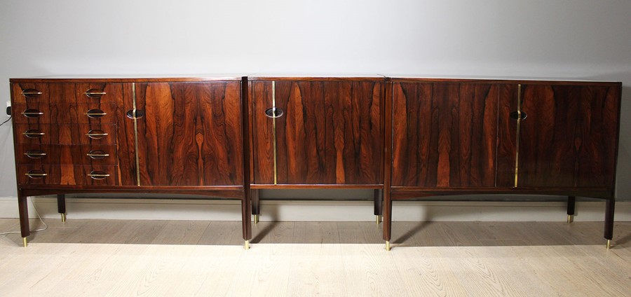 A ROSEWOOD MODULAR SIDEBOARD, ITALIAN 1960s BY VITTORIO DASSI, comprising a pair of cabinets, each