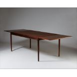 A ROSEWOOD EXTENDING DINING TABLE, DANISH 1960s, by Johannes Andersen for Christian Linneberg,