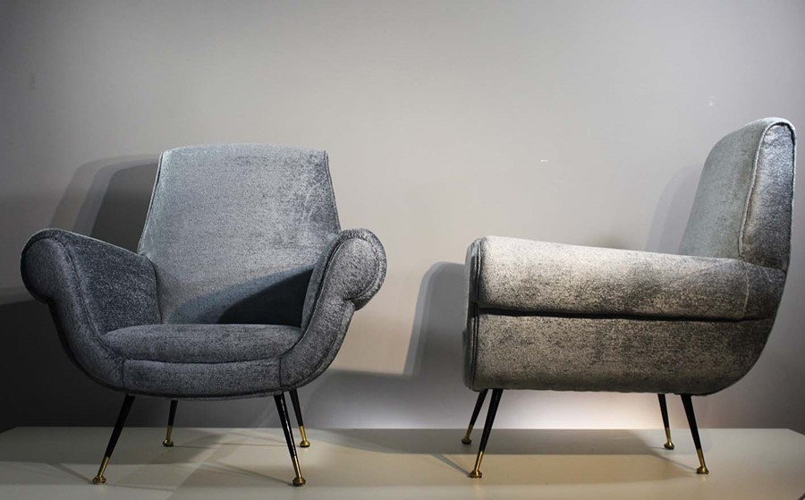A PAIR OF ITALIAN UPHOLTERED EASY CHAIRS, 1960s, on tapering legs, with brass feet (2).