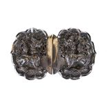 A LATE 19TH/EARLY 20TH CENTURY EASTERN WHITE METAL BUCKLE with pierced mythical beast design.