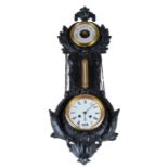 A LATE VICTORIAN FOLIATE CAST IRON WALL CLOCK/BAROMETER with white enamel dial and twin train
