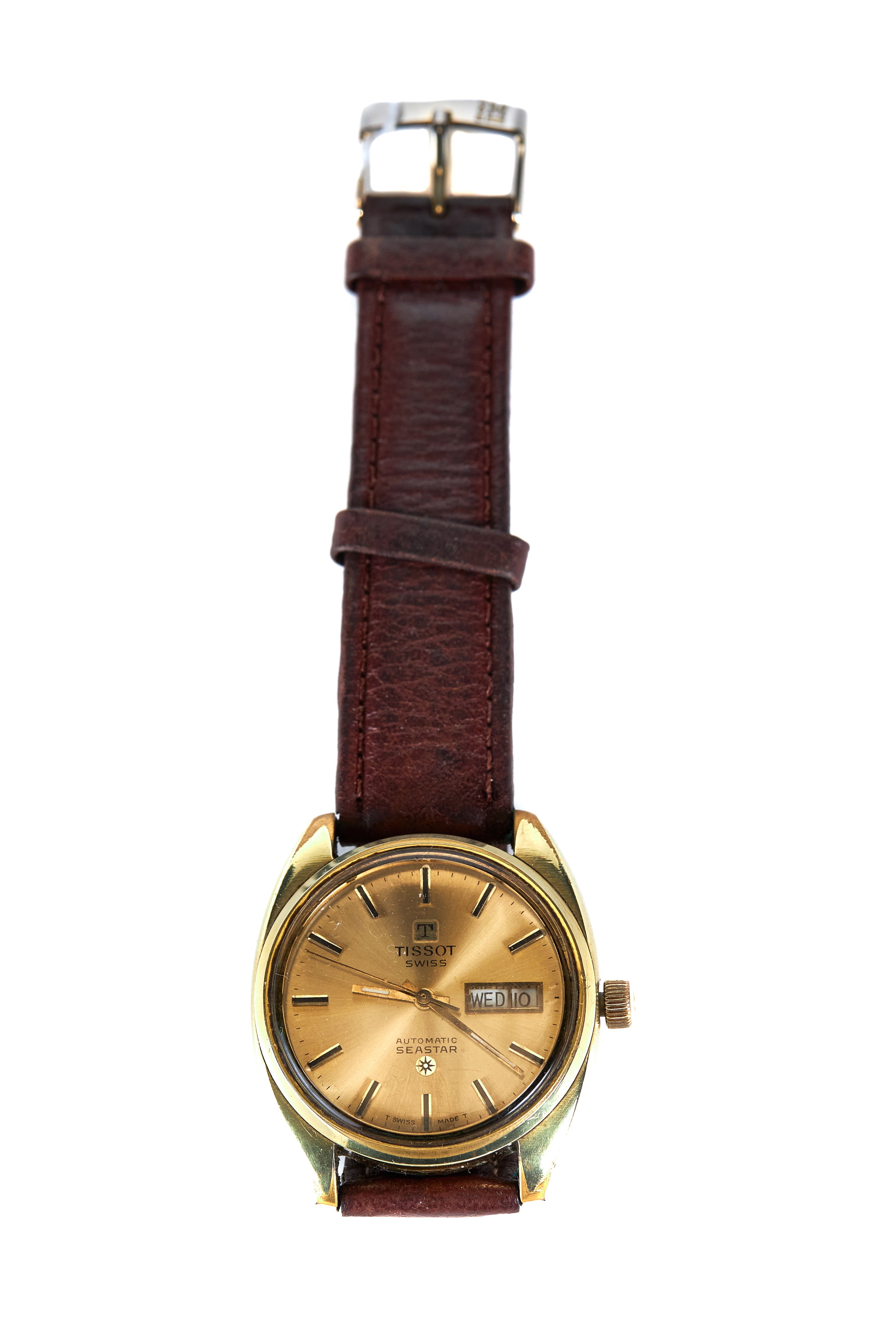 A GENTS TISSOT SEASTAR AUTOMATIC GOLD PLATED WRIST WATCH, champagne dial with day/date,