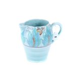 A 20TH CENTURY CLARICE CLIFF NEWPORT POTTERY JUG, blue glazed with moulded floral decoration,