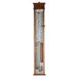 A 19TH CENTURY OAK CASED ADMIRAL FITZROY BAROMETER with internal thermometer, 39 1/2 ins high.