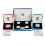 A 2003 SET OF FOUR PROOF SILVER £1 PATTERN COINS, boxed,
