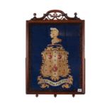 A VICTORIAN ROSEWOOD FRAMED ARMORIAL WOOLWORK TAPESTRY,