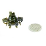A SMALL CHINESE SPINACH GREEN JADE CENSER AND COVER with kylin dog ring handles,