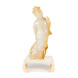 A CHINESE MUTTON FAT AND YELLOW JADE CARVING OF GUANYIN,