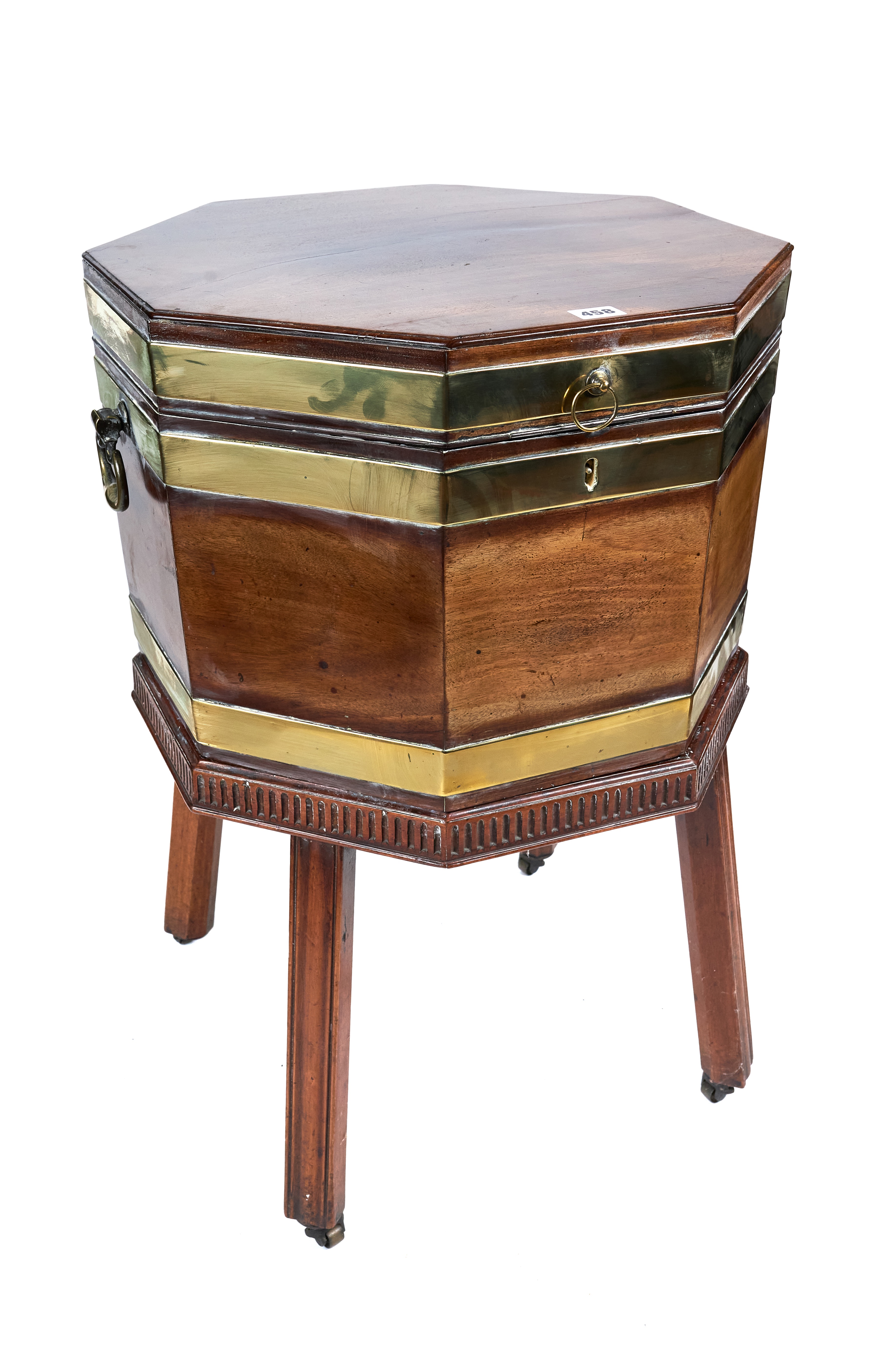 A GEORGE III MAHOGANY OCTAGONAL BRASS BOUND WINE COOLER raised on a detachable stand with moulded