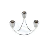 A MODERNIST STERLING SILVER THREE BRANCH TABLE CANDELABRUM, each sconce on an arched support,