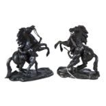 A PAIR OF LATE 19TH CENTURY SPELTER MARLY HORSES and attendants, after R. COUSTOU, 7 3/4 ins high.