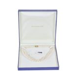 A NICELY GRADED DOUBLE ROW CULTURED PEARL NECKLACE with a 14k gold clasp (2004 valuation for £399).