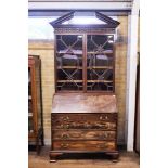 A GEORGE III MAHOGANY BUREAU BOOKCASE, the pierced broken arch pediment above a pierced frieze,