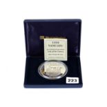 A 1995 QUEEN ELIZABETH II PROOF SILVER 100 VATU COIN, approximately 165.5 grams, boxed.