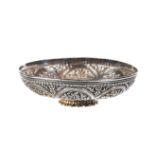 A 19TH CENTURY FINELY DECORATED INDIAN WHITE METAL BOWL decorated with panels of flowers and birds,