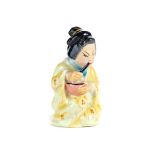 AN EDWARDIAN ROYAL WORCESTER PORCELAIN CANDLE SNUFFER of a Japanese Geisha, puce printed mark,