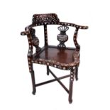 A LATE 19TH CENTURY CHINESE HARDWOOD AND FOLIATE MOTHER-O-PEARL INLAID CORNER CHAIR,