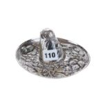 A NOVELTY MEXICAN STERLING SILVER SOMBRERO with embossed floral decoration, stamped 925 sterling,