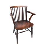 A 19TH CENTURY COUNTRY MADE BEECHWOOD AND ELM STICK BACK ELBOW CHAIR with solid saddle seat raised