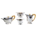 A GEORGE VI FOUR PIECE SILVER TEA SET, of bowed rectangular form with foliate engraved band,