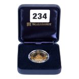 A 1997 QUEEN ELIZABETH THE QUEEN MOTHER 14CT GOLD 100 VATU COIN, approximately 7.7 grams, boxed.