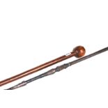 A 19TH CENTURY ZULU HARDWOOD RIBBED BALL ENDED CLUB,