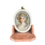 A 19TH CENTURY OVAL MINIATURE ON IVORY, head and shoulders of a young lady, unsigned,