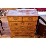 AN 18TH CENTURY WALNUT VENEERED CHEST OF DRAWERS,