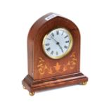 AN EDWARDIAN INLAID WALNUT LANCET-CASED MANTEL CLOCK, circular enamel dial with platform esacpement,