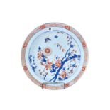 AN UNUSUAL 18TH CENTURY CHINESE IMARI PORCELAIN CHARGER decorated with flowering branches,