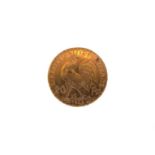 A 1908 GOLD 20 FRANC COIN, approximately 6.4 grams.