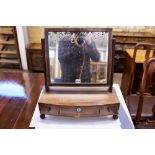 AN EARLY 19TH CENTURY MAHOGANY BOW-FRONTED BOX BASE SWING TOILET MIRROR, three drawers,