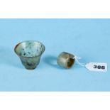 AN ANTIQUE CHINESE JADE ARCHERS RING of cylindrical form and a small translucent jade TEA BOWL,