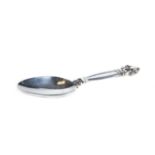 A GEORG JENSEN SILVER CADDY SPOON, foliate scroll terminal handle, oval mark,