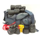 A Canon EOS 35mm film camera together with bag,