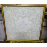 A framed lace tablecloth CONDITION: Please Note - we do not make reference to the