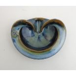 A 21stC Colm De Ris Studio Pottery, Ireland dish , having Celtic style detail to side,