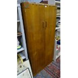 A 2 door light oak wardrobe by E.