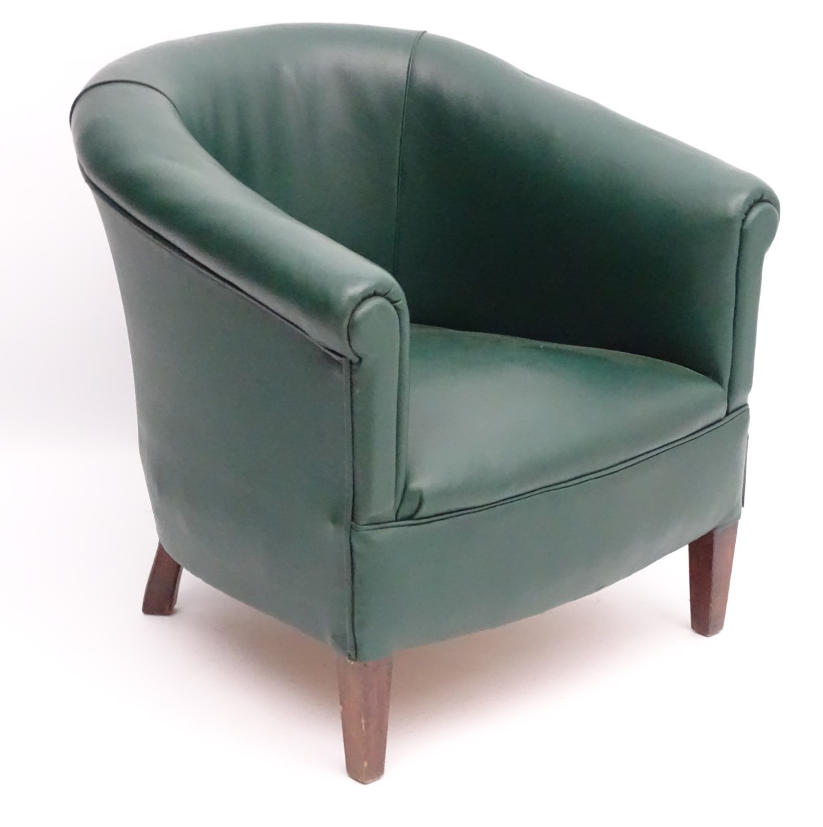 A mid 20thC green tub chair standing on squared tapering legs. 28” wide x 25” deep.