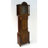 A mahogany, North Country grandfather clock case: a 19thC figured mahogany short door longcase case,