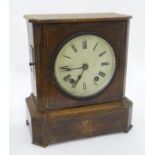 A walnut cased mantel clock CONDITION: Please Note - we do not make reference to