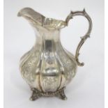 A silver plated jug CONDITION: Please Note - we do not make reference to the