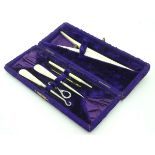 A cased bone manicure set CONDITION: Please Note - we do not make reference to the