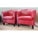 A pair of red leather tub chairs by Wittmann,