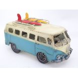 A model of a Voltswagen campervan with surfboards CONDITION: Please Note - we do