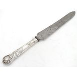 A white metal handled knife CONDITION: Please Note - we do not make reference to